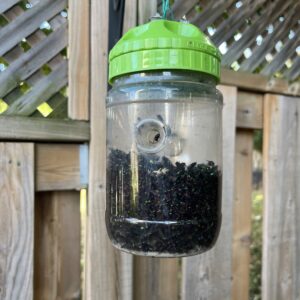 GREENSTRIKE Large Fly Trap (32 oz.) with a food-grade attractant and innovative 6-hole cap design for higher effectiveness. Made in Canada